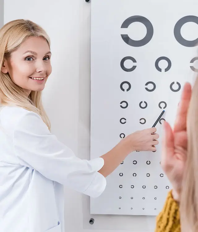 Eye specialist showing eye chart - Dr. Rakesh Eye Hospital Karimnagar