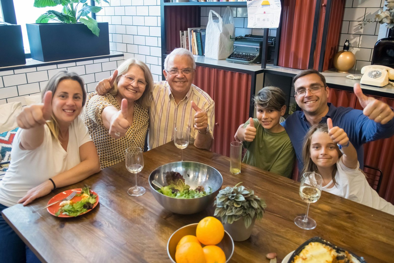 A happy family enjoying a meal together, showcasing togetherness and joy at a dining table.